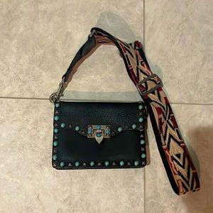 Beautiful Valentino guitar strap rock stud bag.
